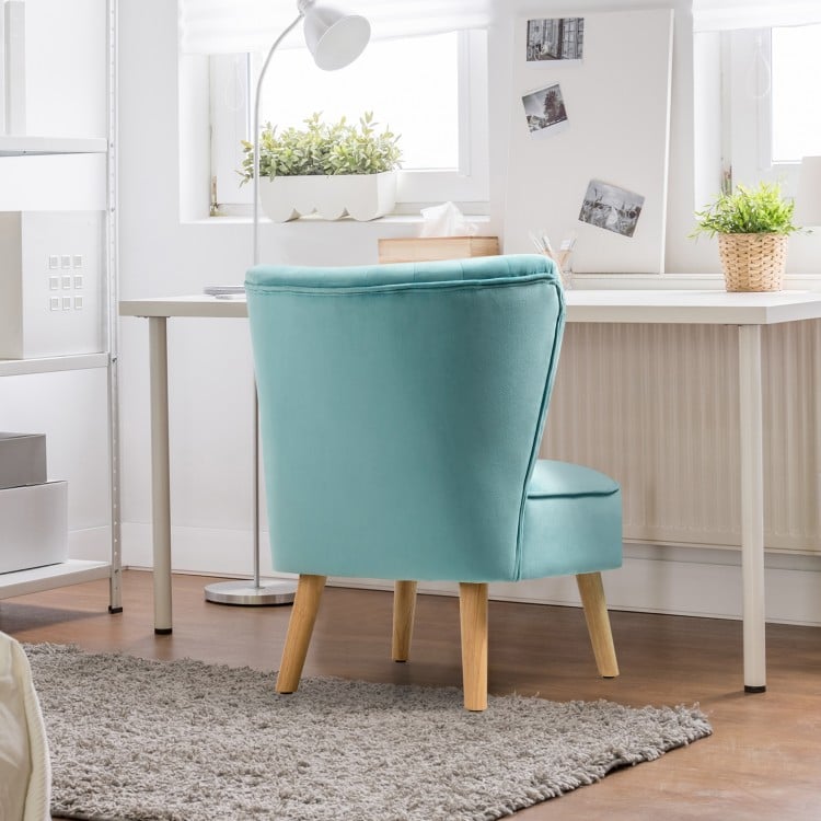 Modern armless velvet accent chair in green with rubber wood legs, perfect for home or workspace comfort.