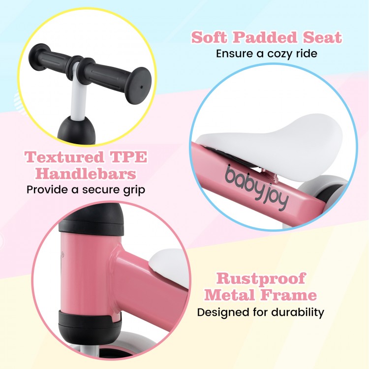 Soft padded seat and textured TPE handlebars on the pink baby balance bike for secure and cozy rides.