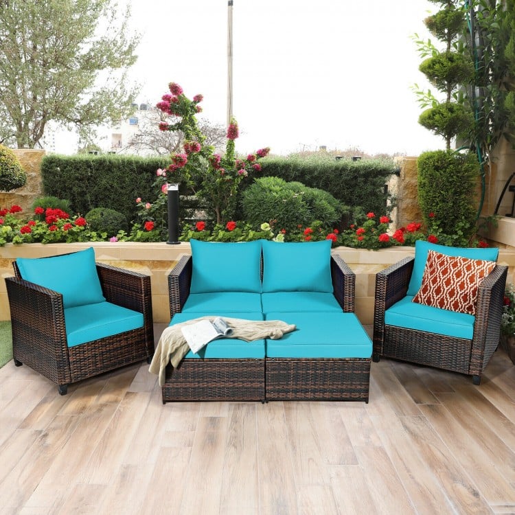 Side view of the 5-piece turquoise patio furniture set, showcasing comfortable sofas and ottomans for outdoor.
