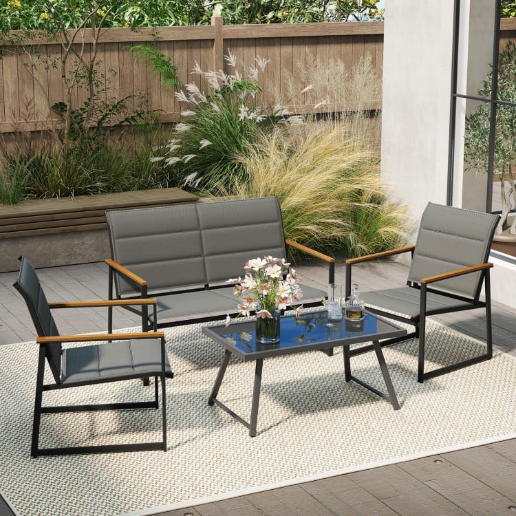 4-piece gray outdoor conversation set featuring a loveseat, two armchairs, and a coffee table for patio relaxation.