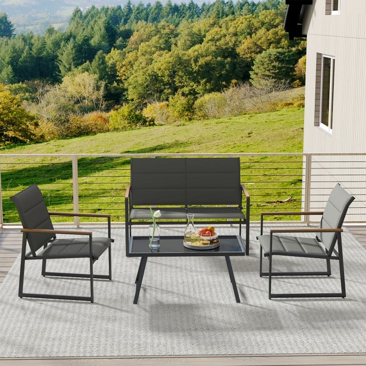 4-piece gray outdoor conversation set featuring a loveseat, two armchairs, and a coffee table for backyard relaxation.