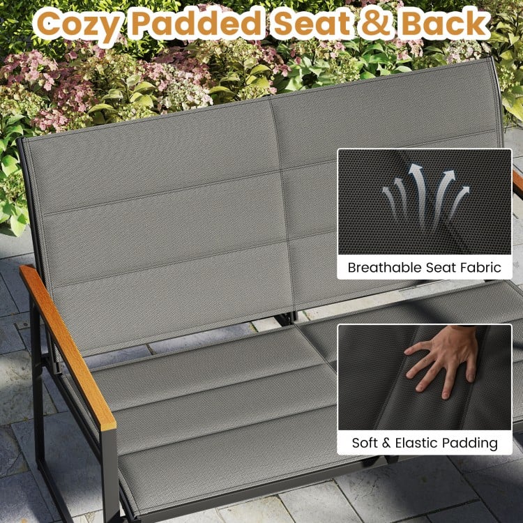 Cozy padded loveseat with breathable fabric and soft padding, perfect for outdoor relaxation in your patio or garden.