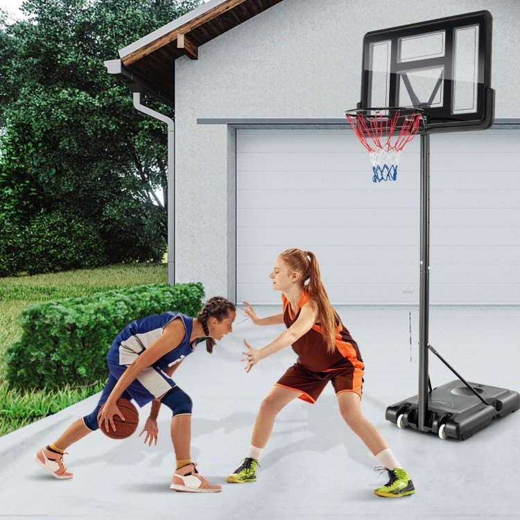 Two girls playing basketball near a 4.25-10 feet adjustable hoop system with shatterproof backboard.