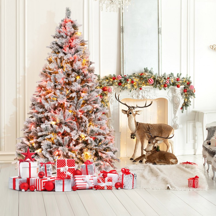 7 ft artificial Christmas tree with white flocking, LED lights, and pine cones, perfect for festive home decor.