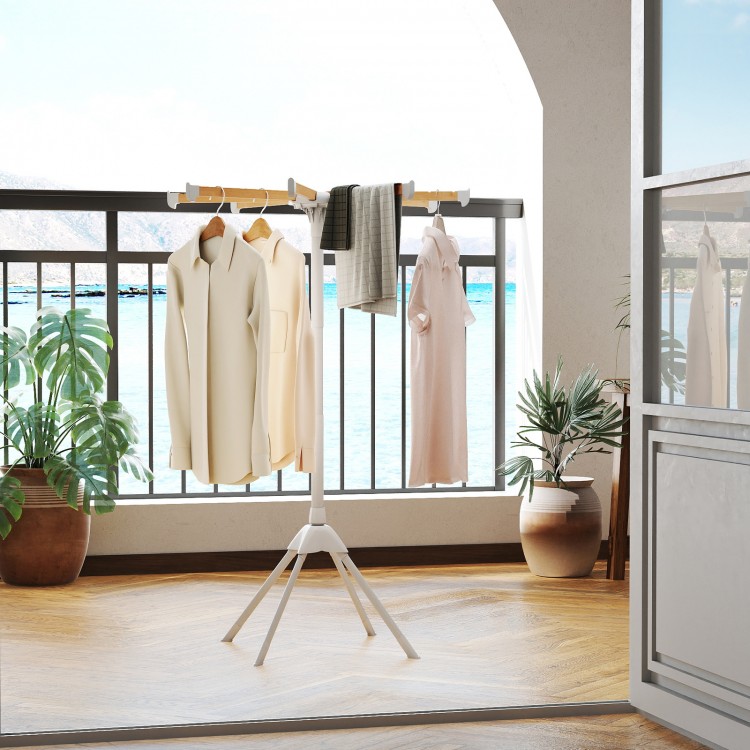 Foldable clothes drying rack with 8 bamboo rods and 40 hanger slots, ideal for drying clothes on a balcony.