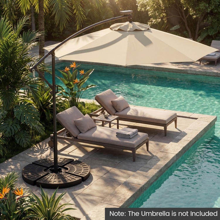 Heavy-duty black patio umbrella base with interlocking plates, designed for stability and easy setup, ideal for outdoor.