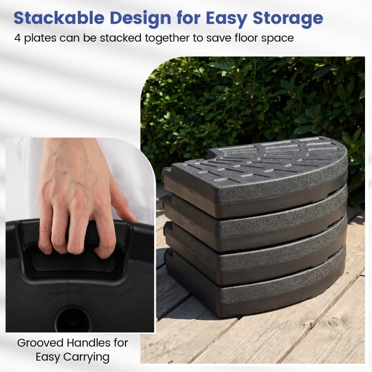 Stacked 4-piece patio umbrella base in black with grooved handles for easy carrying and space-saving storage.