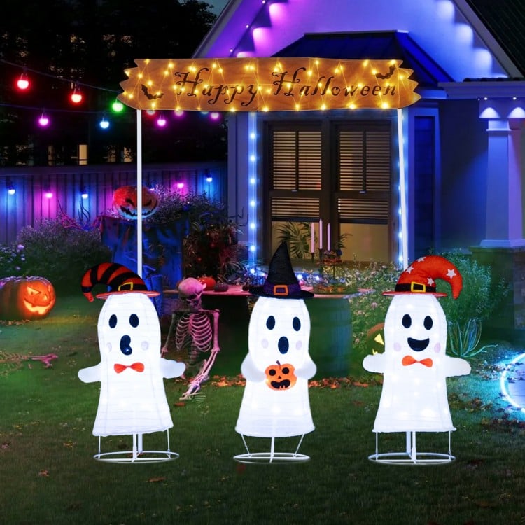 Three playful pop-up ghosts with LED lights and a "Happy Halloween" sign, perfect for outdoor Halloween decorations.