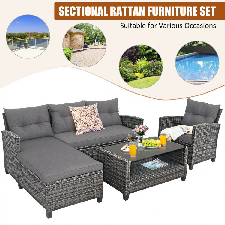 Sectional 4-piece patio rattan furniture set with gray cushions and table, perfect for backyard and poolside relaxation.