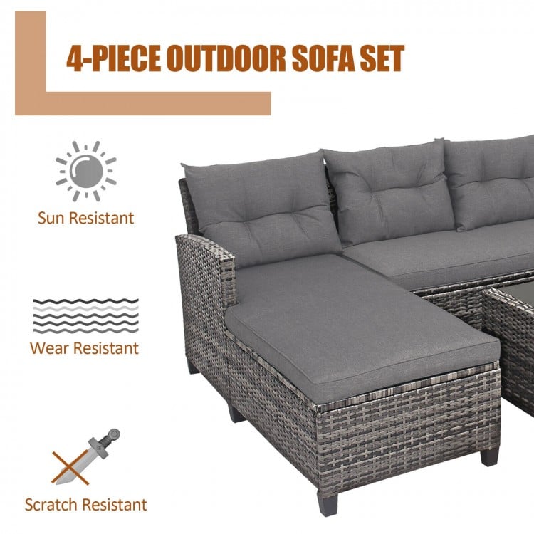 4-piece patio rattan sofa set with gray cushions, featuring a coffee table, ideal for backyard and poolside relaxation.