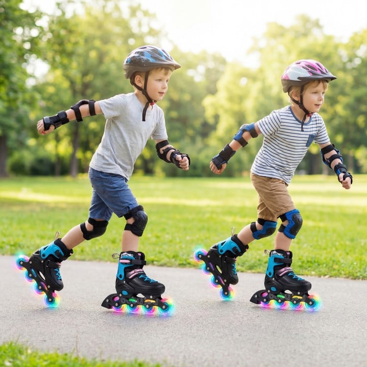Two kids skating on 4-size adjustable light-up inline skates with LED wheels in a park, promoting balance and.