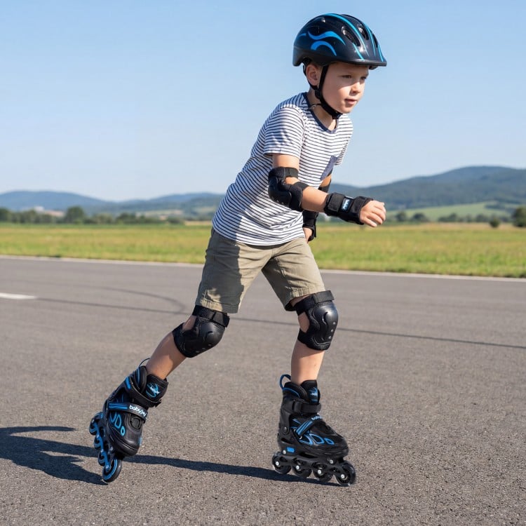 Youth in blue adjustable roller skates with light-up wheels, showcasing safety gear while skating outdoors.