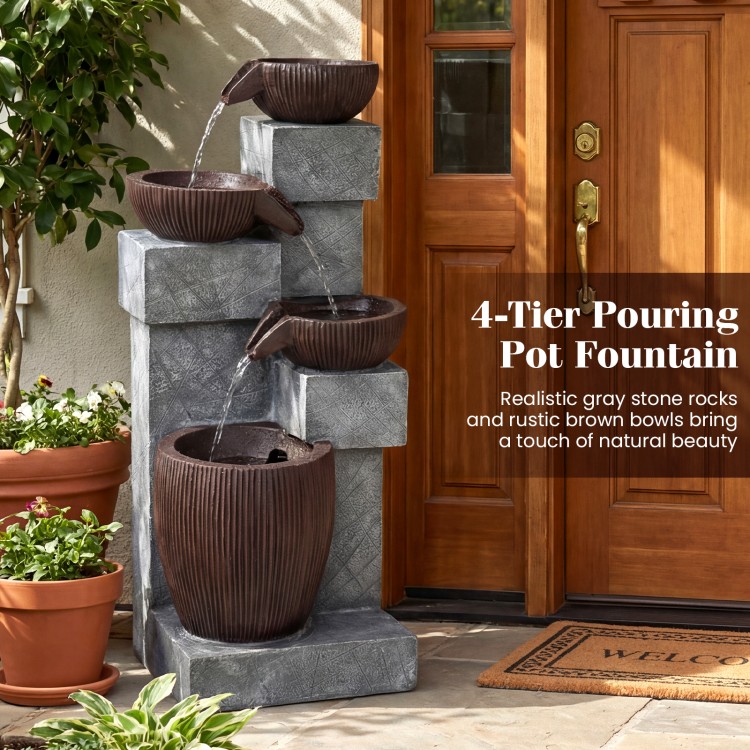 4-tier cascading bowl outdoor water fountain with gray stone rocks and brown bowls, creating a soothing ambiance.
