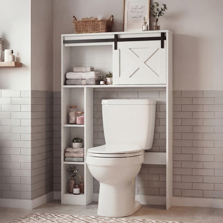 4-tier over-the-toilet storage cabinet in white with sliding barn door, ideal for bathroom organization and easy access.