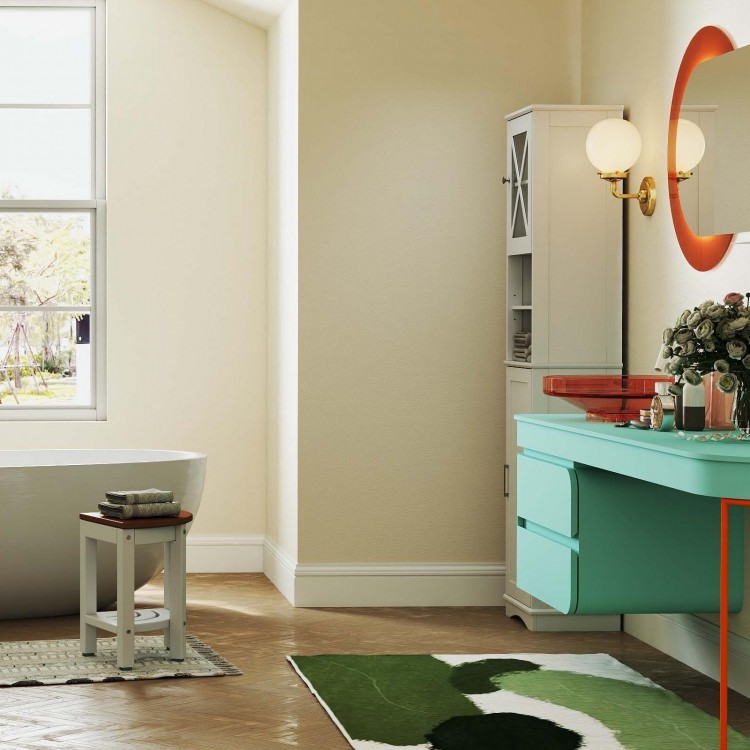 Tall storage cabinet and shower bench in a modern bathroom, featuring elegant design and multiple storage options.