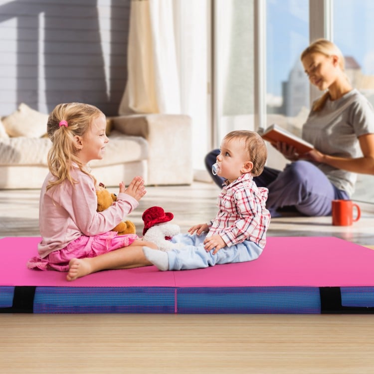Bi-folding pink gymnastic tumbling mat with handles, ideal for kids' activities like crawling and yoga.