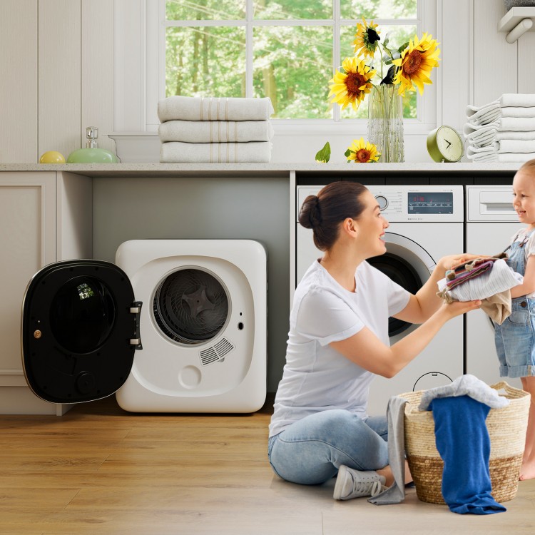 Portable clothes dryer with stainless steel tub, shown in a laundry setting, efficiently drying garments with a compact.
