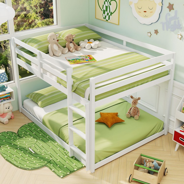 Low-to-ground white full over full bunk bed with guardrails and integrated ladder, perfect for kids' rooms.
