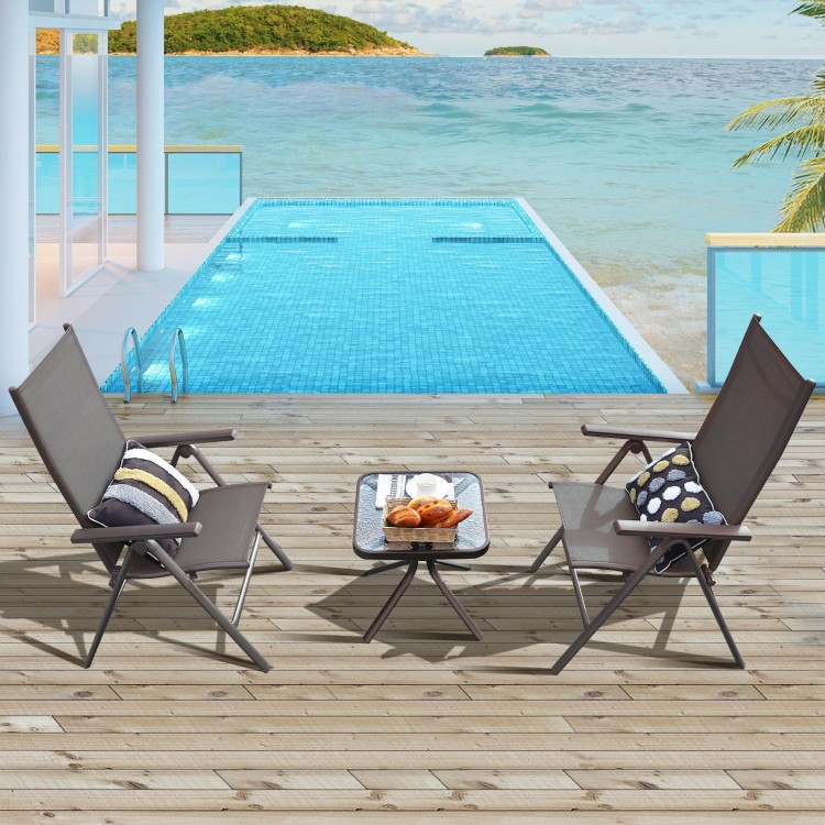 Two gray aluminum folding dining chairs with adjustable backs, perfect for poolside relaxation or outdoor dining.