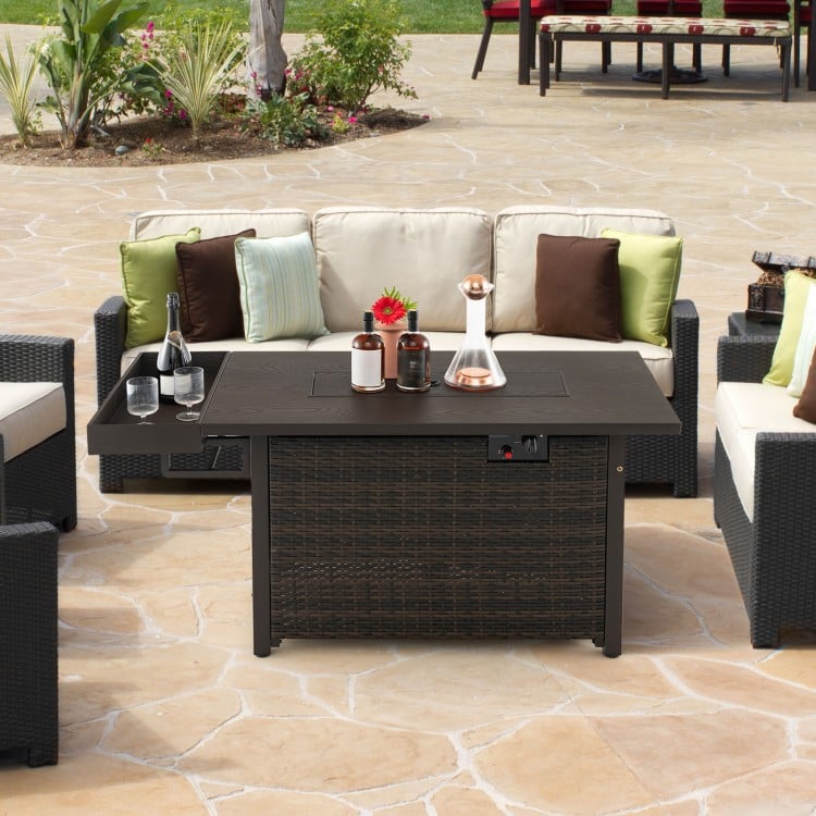 Outdoor wicker gas fire pit table with brown finish, 50,000 BTU output, and removable lid for versatile use.