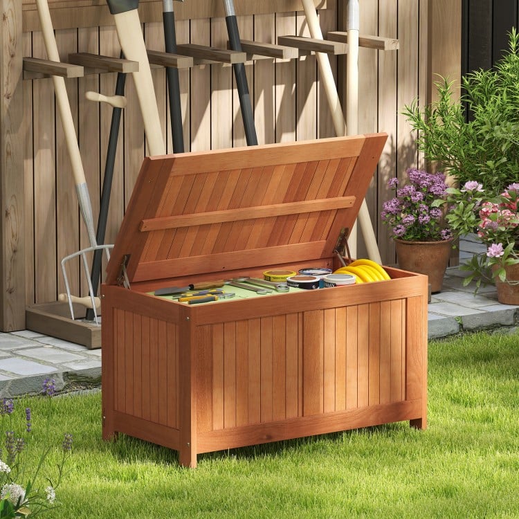 Wood deck box with flip top, 52-gallon capacity, ideal for cushions and tools, perfect for outdoor storage and seating.