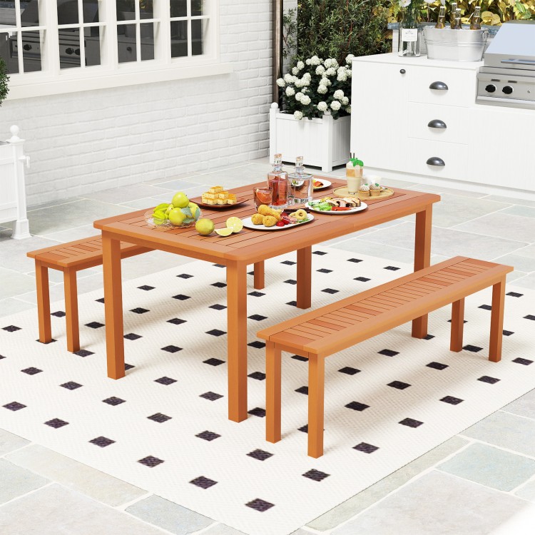 Backless wooden bench with teak oil finish, slatted design for ventilation, ideal for outdoor dining on patio or porch.