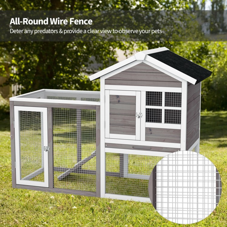 2-story wooden rabbit hutch in gray with a large running area, non-slip ramp, and all-round wire fence for outdoor use.