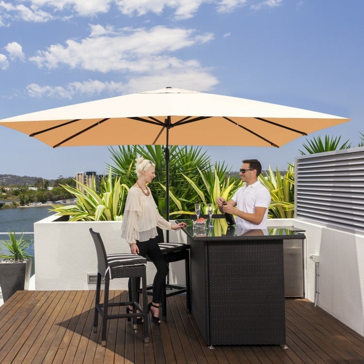 Rectangular cantilever umbrella in beige with 360° rotation, providing large shading coverage for outdoor relaxation.