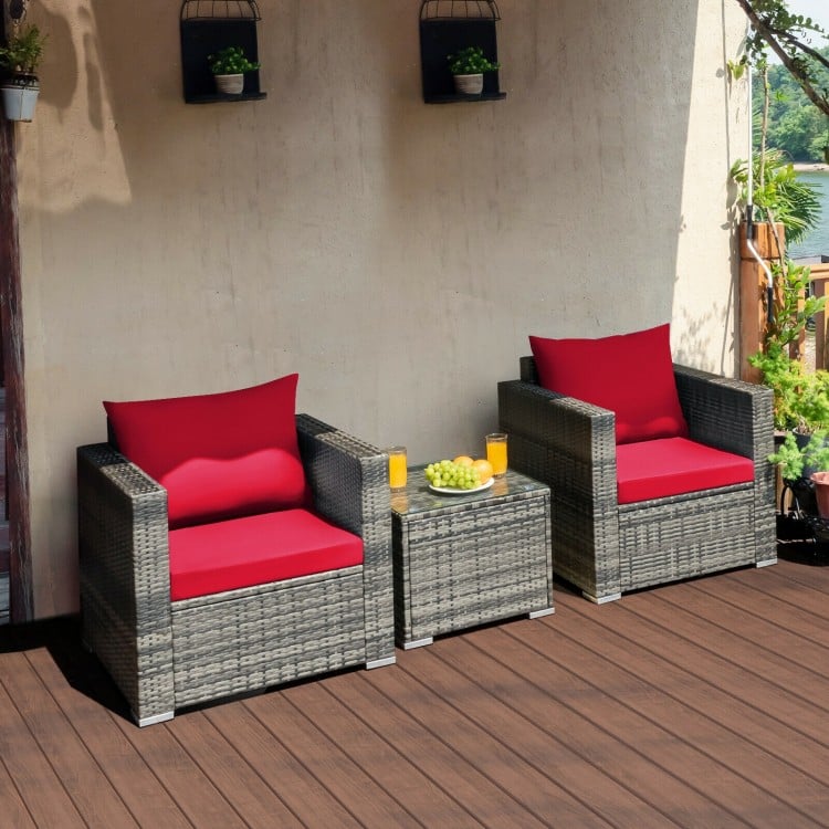 Two cushioned red chairs and a glass-top table from the 3 Pcs Patio Rattan Furniture Bistro Sofa Set for outdoor.