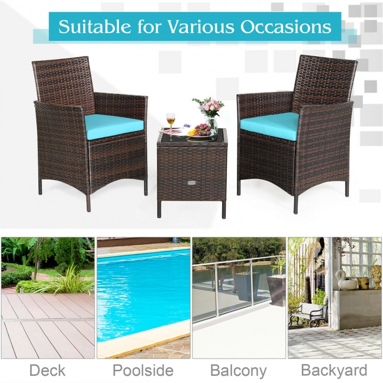 3-piece patio rattan furniture set with blue cushions and glass tabletop, perfect for outdoor relaxation on the deck or.