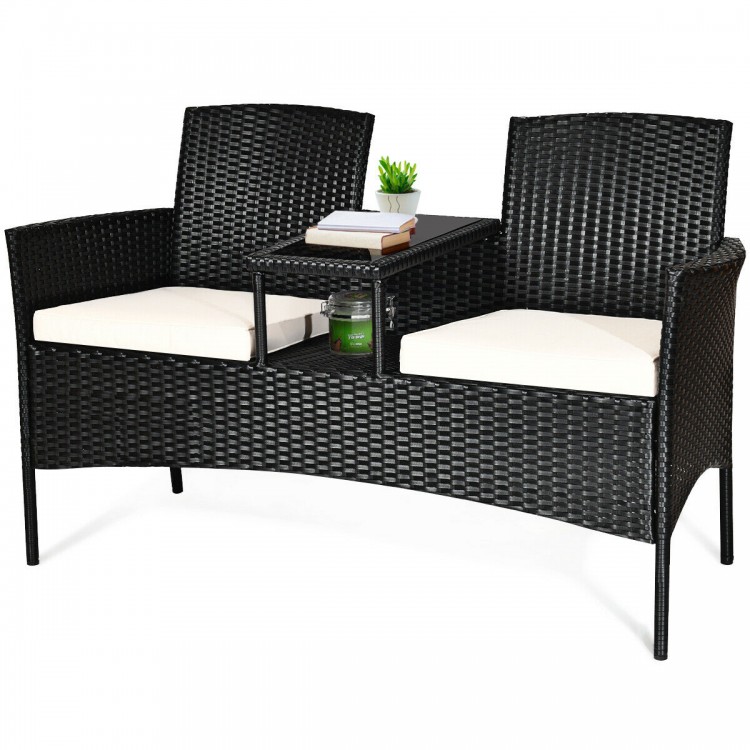 Wicker patio conversation set featuring removable cushions, tempered glass table, and ergonomic design for outdoor.