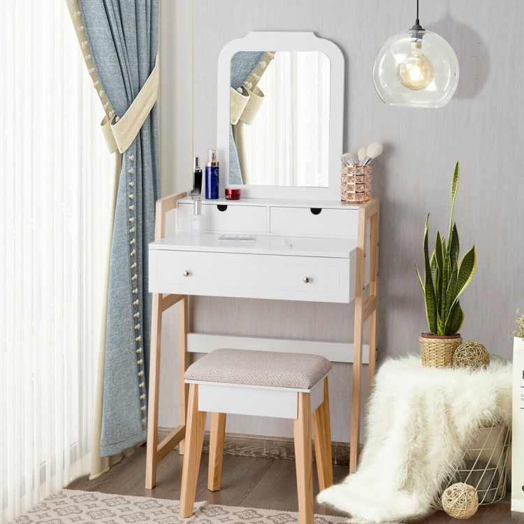 Large mirror on a vanity table set with white finish and sturdy pine wood legs, ideal for makeup application and decor.