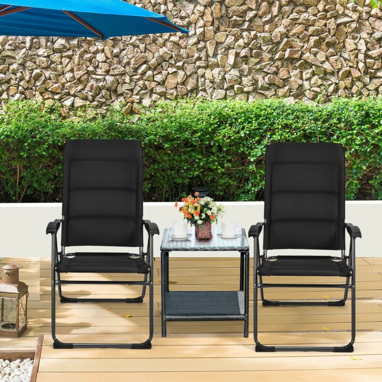 Two black outdoor folding patio chairs with adjustable backrests, perfect for bistro or backyard relaxation.