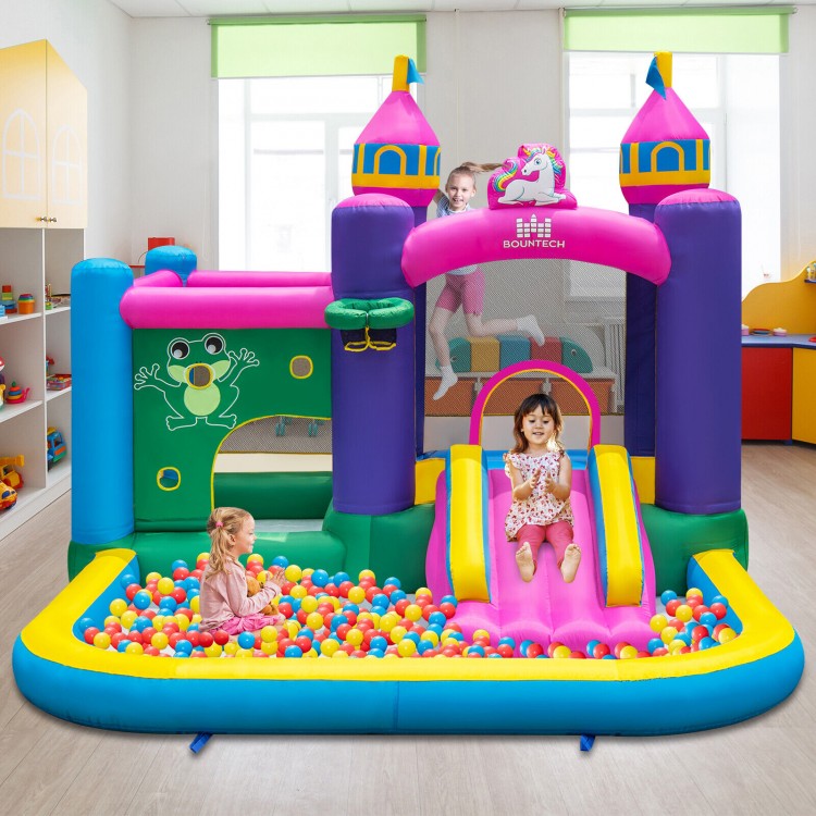 Unicorn-themed inflatable bounce house with slide, ball pit, and mesh walls for safe play, perfect for kids' parties.