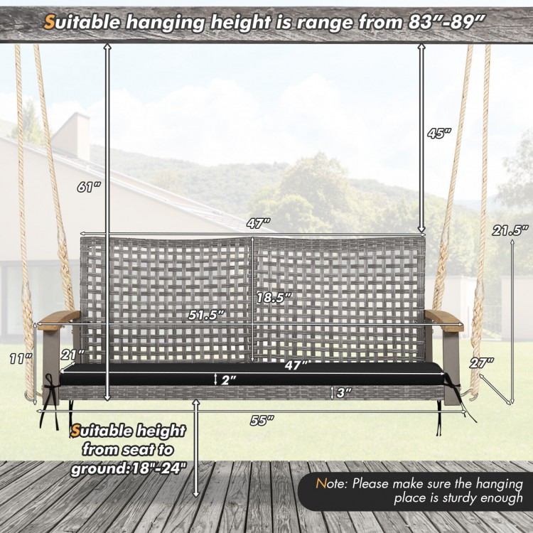 2-person patio wicker hanging swing chair in black with acacia wood armrests, suitable for backyard or garden use.
