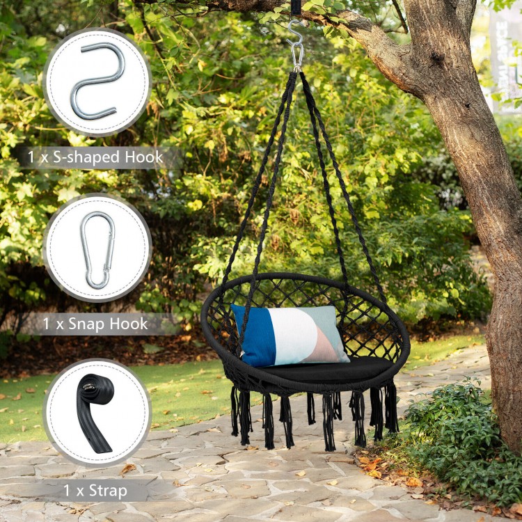Cushioned black hammock swing chair with tassels and hanging kit, designed for comfortable indoor or outdoor relaxation.