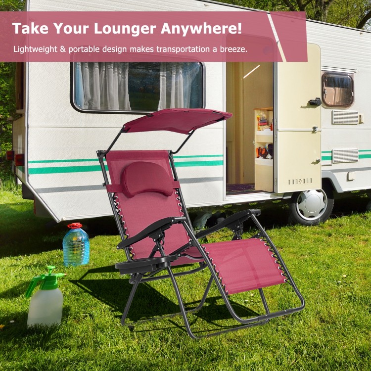 Folding recliner lounge chair with adjustable shade canopy and cup holder, perfect for outdoor relaxation and comfort.