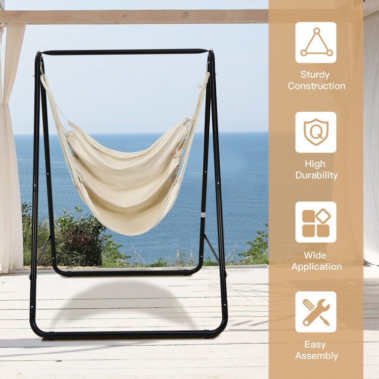 Hanging padded hammock chair with stand in beige, featuring sturdy steel construction for indoor and outdoor use.