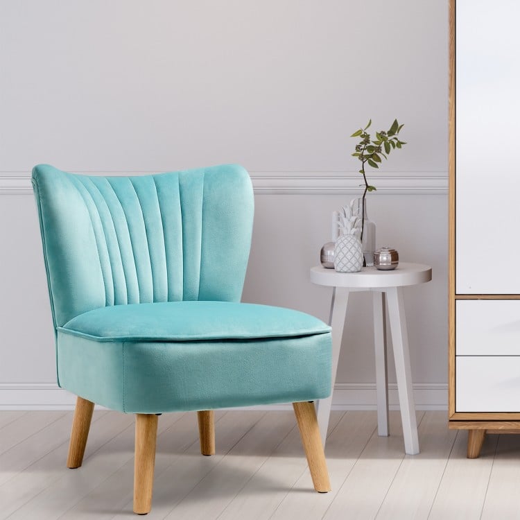 Modern armless velvet accent chair in green with rubber wood legs, ideal for living room or workspace comfort.