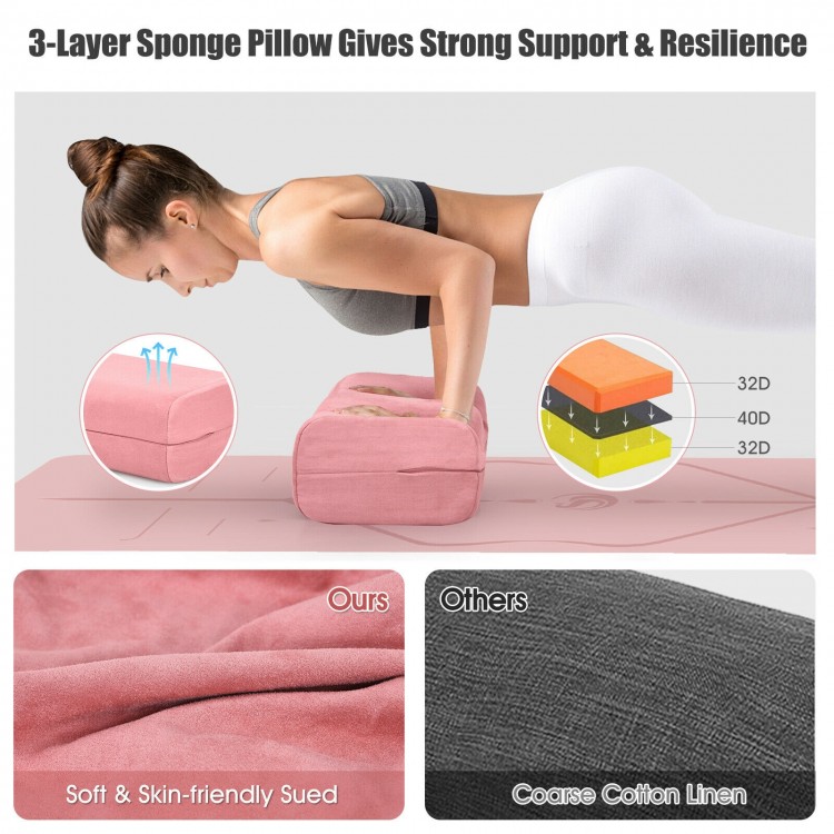 Yoga bolster pillow in pink with a soft suede cover, featuring a carry handle for easy transport and support during.