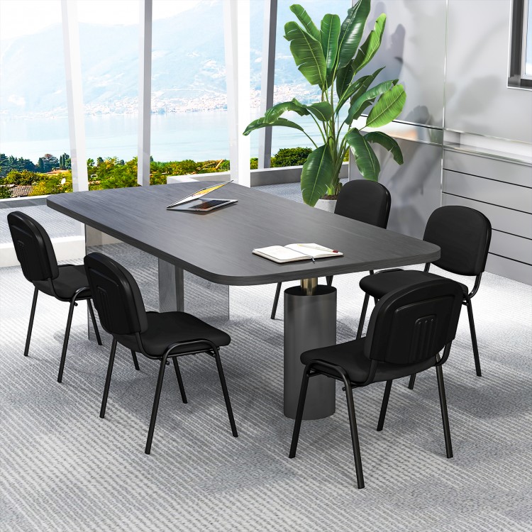 Conference room featuring a set of 5 black office chairs with metal frames and padded cushions for ergonomic support.