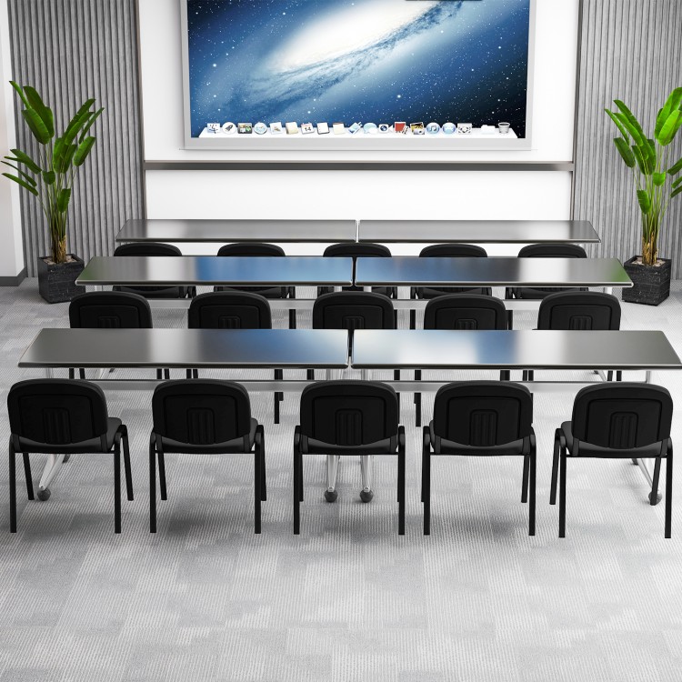 Conference room setup featuring five black office chairs with metal frames and padded cushions for ergonomic support.