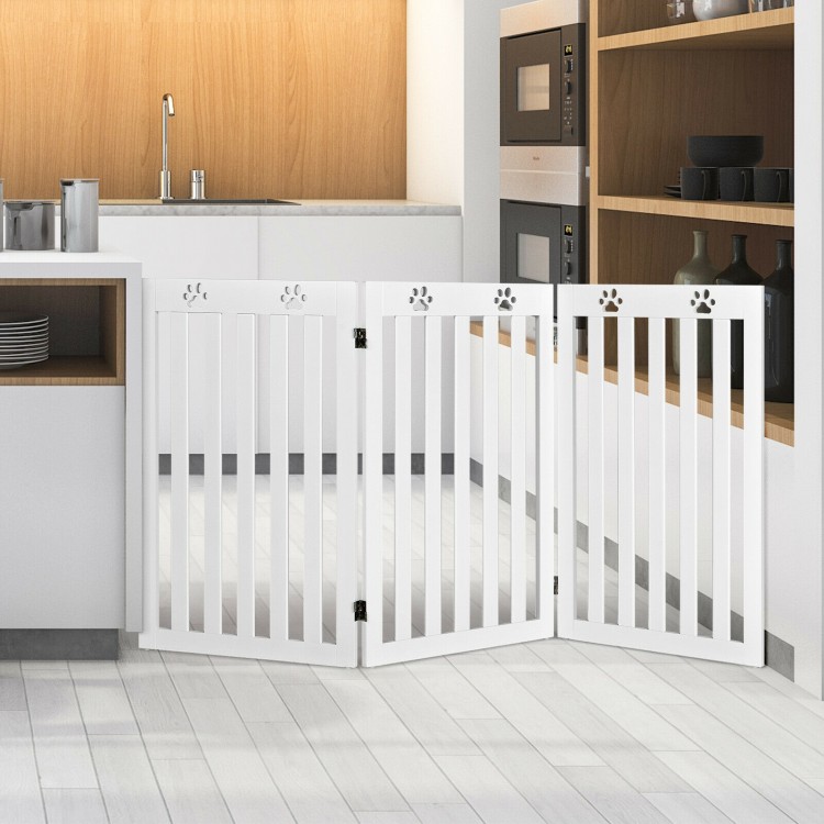 Freestanding 36-inch white wooden pet gate with flexible hinges, ideal for kitchen and doorway safety for small dogs.