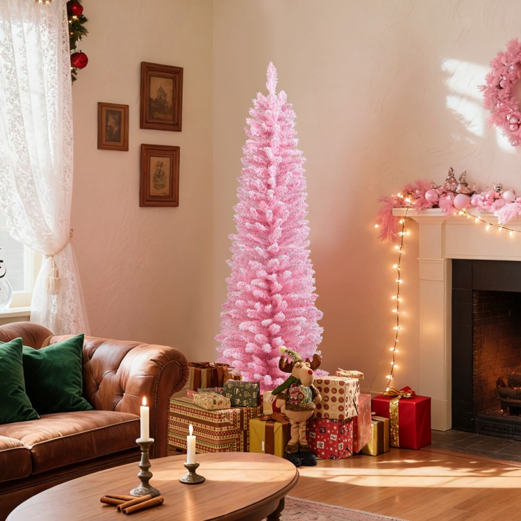 Pink 5-foot artificial Christmas tree with 328 branch tips, set up in a cozy living room for festive holiday decor.