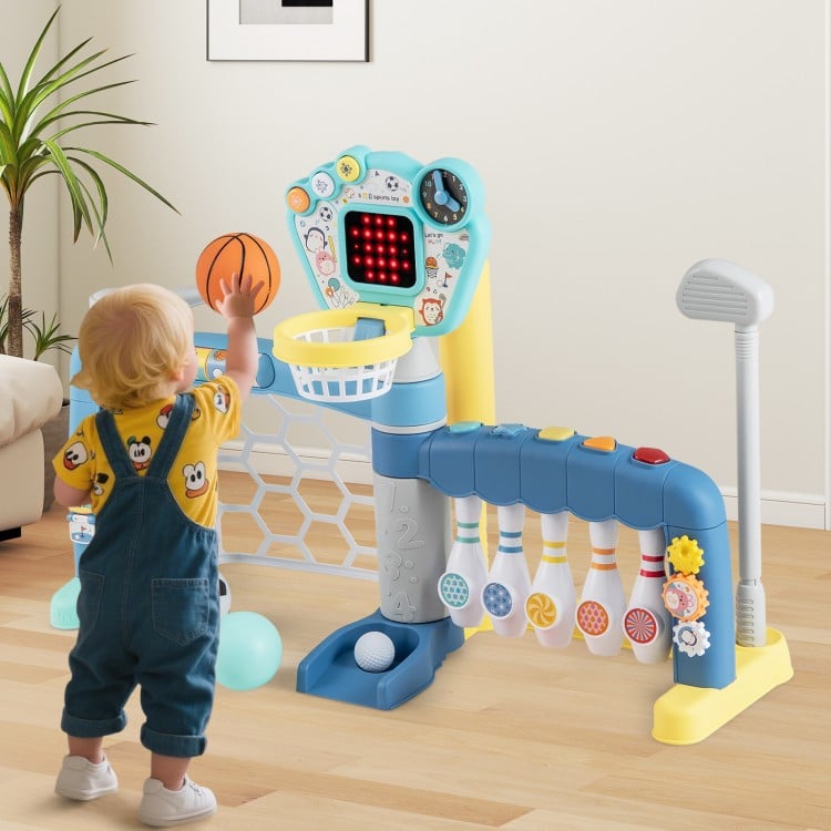 Toddler reaching for the adjustable basketball hoop on the 5 in 1 sports toy, promoting motor skills and coordination.