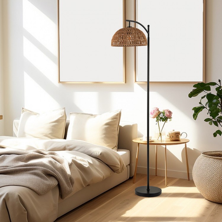 Arc floor lamp with a black pole and woven hanging lampshade, ideal for living room or bedroom lighting.