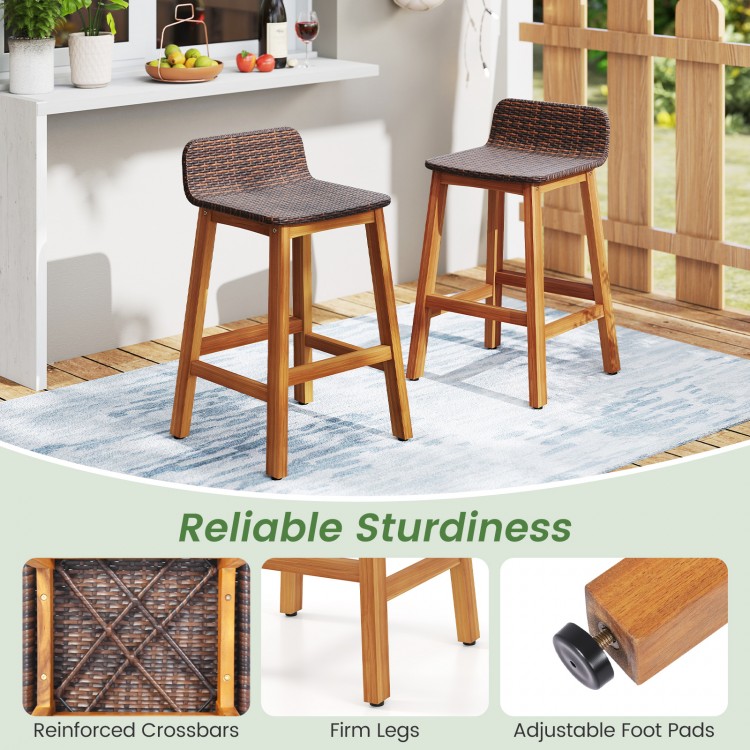 Set of 2 solid acacia wood bar stools with PE rattan seats, backrests, and footrests, ideal for porch or balcony use.