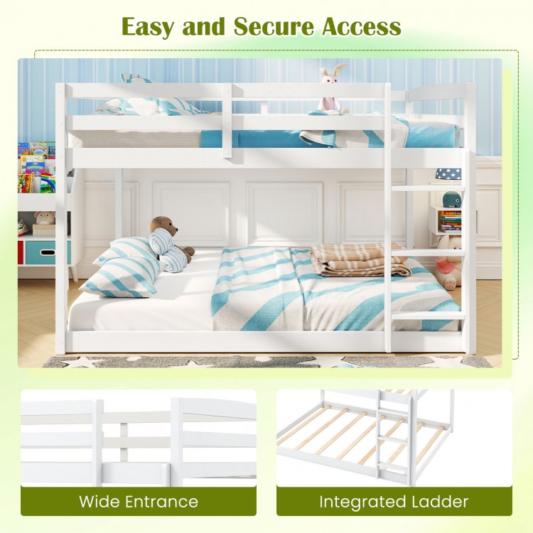 Full over full low-to-ground bunk bed in white with integrated ladder and wide entrance for easy access and safety.
