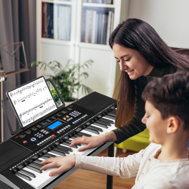 61-key electronic keyboard piano set with stand, bench, and headphones, ideal for beginner music lessons.