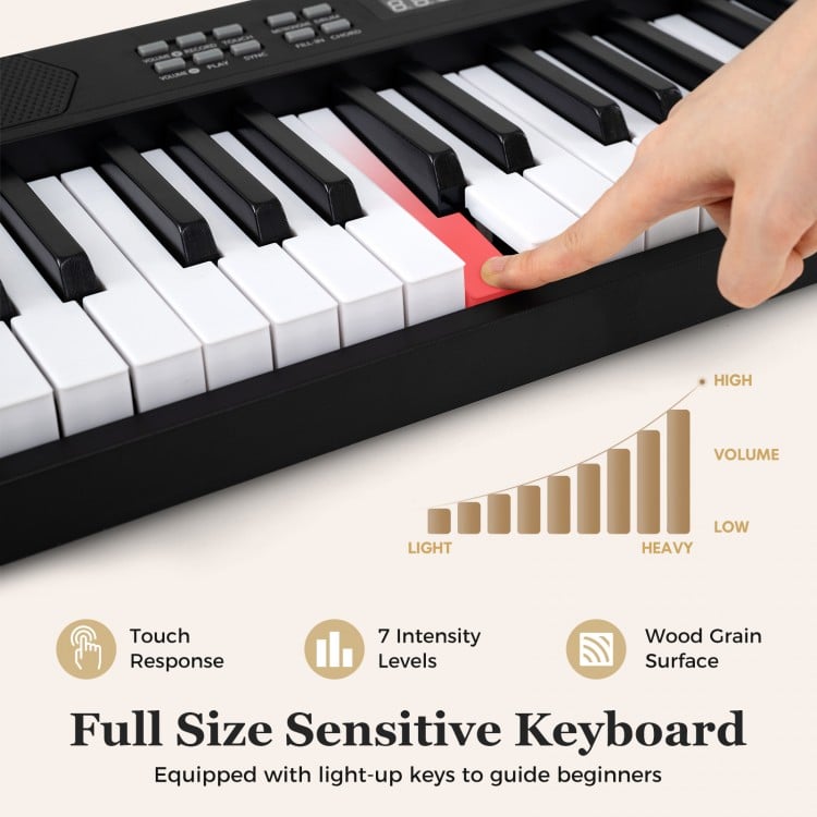 Full-size 61-key foldable electronic keyboard with touch-sensitive keys and wood grain surface for comfortable playing.